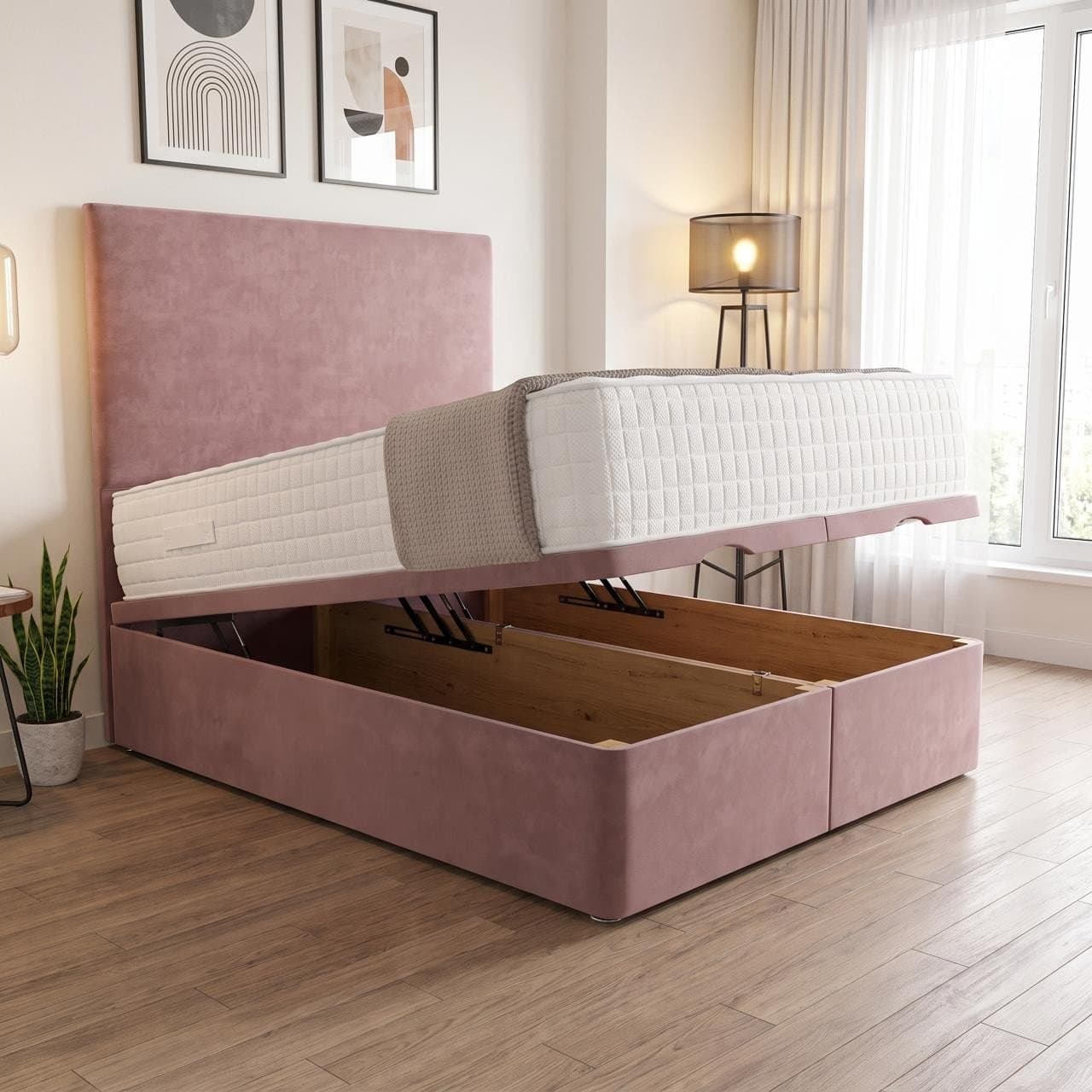 Cavendish ottoman storage bed in blush pink with a plain flat-panel headboard, base raised to show the full-length storage