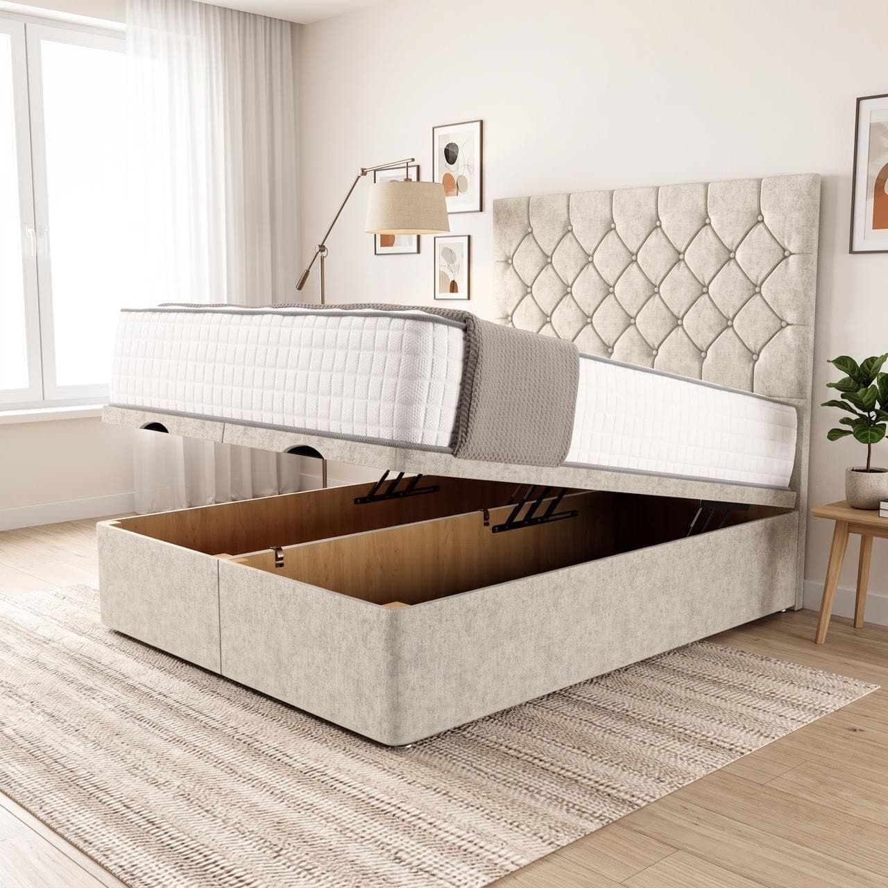 Madison ottoman storage bed in cream with a deep diamond-buttoned headboard, base raised to show the full-length storage