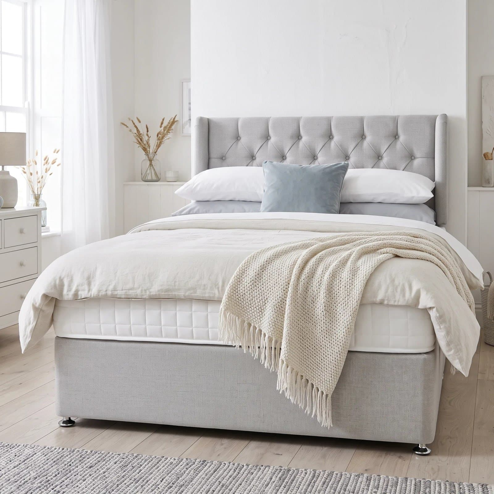 Luxury Pocket 1000 divan bed with a low grey upholstered headboard, quilted pocket-sprung mattress and chrome glide feet, in a bright bedroom